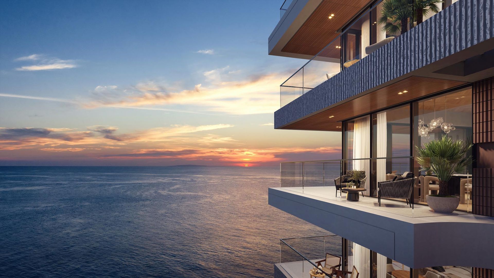 Balcony view over the sea at sunset